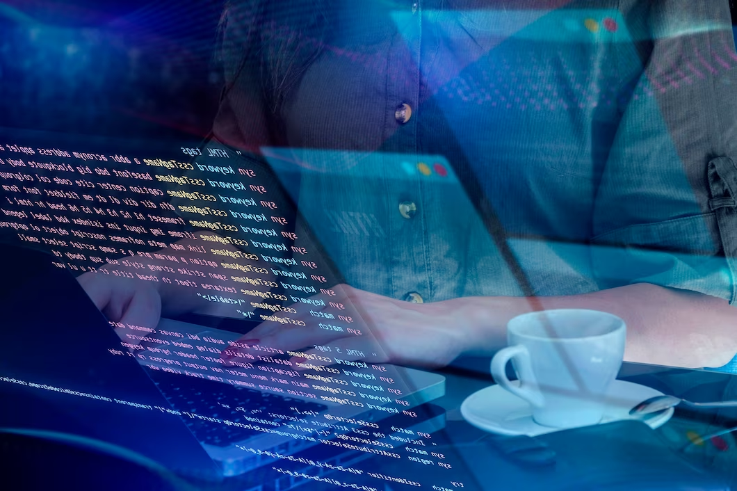 Image of a Man with Coffee, Laptop, and Coding